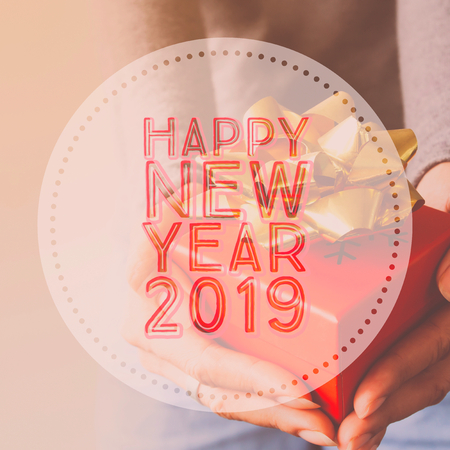Happy New Year 2019, Typography on image hands holding gift boxの写真素材