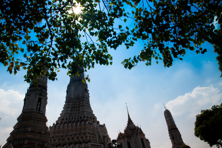BANGKOK, THAILAND - NOV 5, 2018: Wat Arun Ratchawararam Ratchawaramahawihan or Wat Arun is a Buddhist temple in Bangkok on the Thonburi west bank of the Chao Phraya River. Low key image with sun light flareのeditorial素材