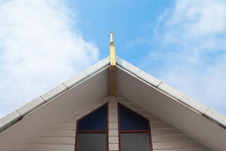 Gable of Thai style building, Thai temple architecture with blue skyの写真素材