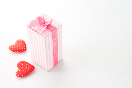 Close up gift box with heart on white backgroundの写真素材