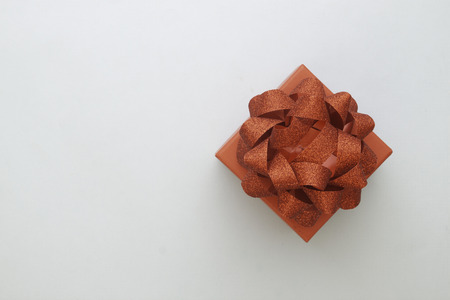 Beautiful red gift box on grey color backgroundの写真素材