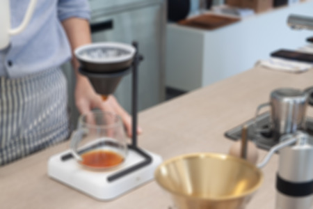 Barista with drip coffee, blurred background or defocusの写真素材