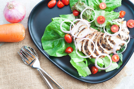 Healthy food, grilled chicken black pepper salad on concrete table. Dieting or kitchen conceptの写真素材