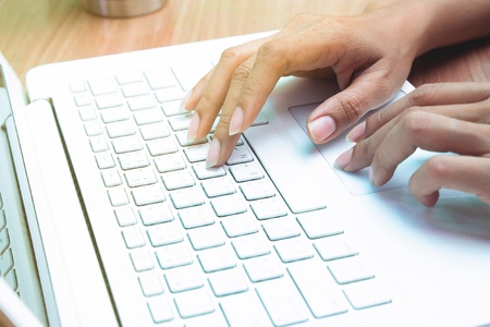 Woman using laptop computer. Working at home. Freelancer. E-business or marketingの写真素材
