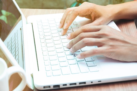 Woman working with laptop. Working at home, lifestyle or social networking conceptの写真素材