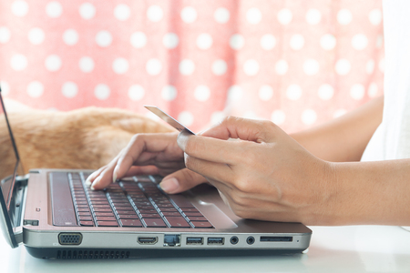 Hands using laptop and credit card. Smart technology. Online shoppingの写真素材