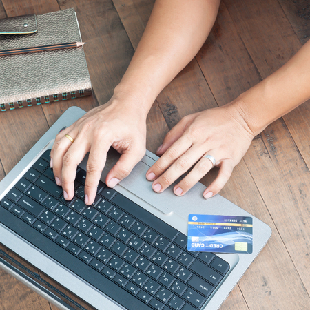 Man hands using laptop and credit card. Online shopping. Online banking shopping, buying, paying, ordering, commercial concept. Shopping online and using credit card.の写真素材