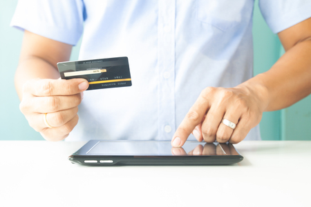 Man hands using tablet and credit card. Online payment. E-business, online bankingの写真素材
