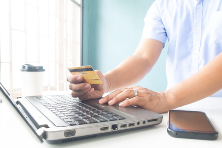 Man hand holding plastic credit card. E-payment, business and online paymentの写真素材