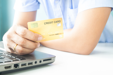 Man hand holding plastic credit card. E-payment, business and money conceptの写真素材
