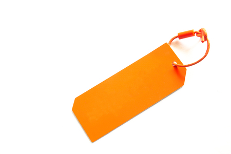 Blank orange color cardboard price tag isolated on white backgroundの写真素材