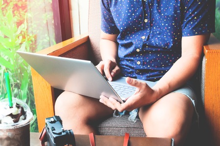 Man hands with laptop, shopping online. Searching for creative idea. Hobby and Technologyの写真素材