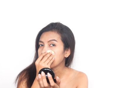 Healthy 40s Asian woman getting make-up on problem skin. Surgery, Health and Beauty concept.の写真素材