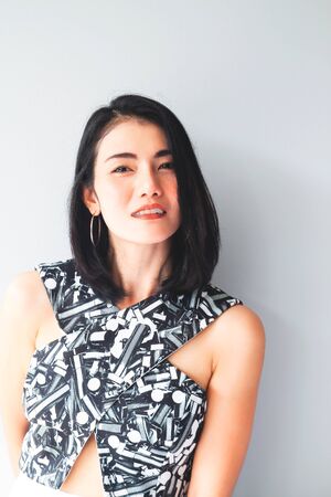 Black hair Asian woman smiling looking to camera. Beauty lifestyle conceptの写真素材