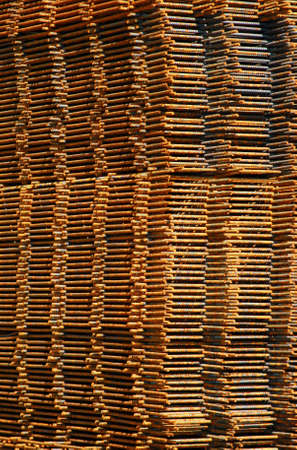 stack of rusty construction steel mats, seen from the corner