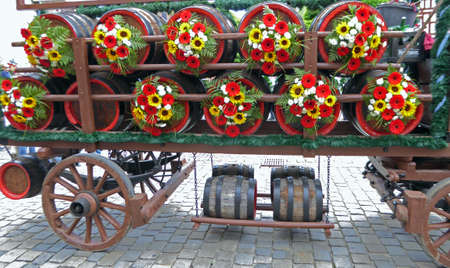 carriage with a lot of beer barrels, decorated with flowers, Bavarian tradition, celebrationの写真素材