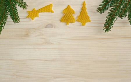 Christmas background with beeswax elements and pine branchesの写真素材