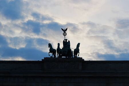 silhouette of the Quadriga at Brandenburger Tor, Berlin, at sunsetの写真素材