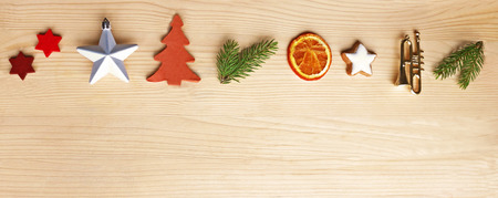 Christmas web banner, retro style border with Christmas ornaments on bright woodの写真素材