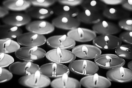 burning tea lights, full frame, black and white photoの写真素材