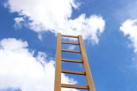 wooden ladder rising up in the sky and to the cloudsの写真素材