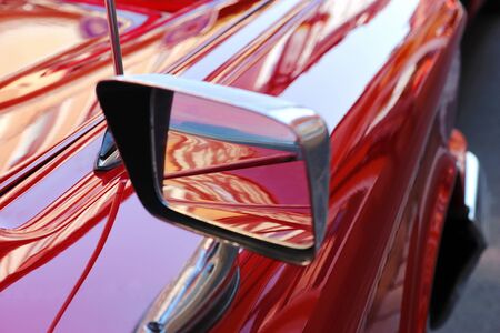 close-up of a red classic car with shiny paint