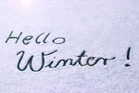 Text Hello Winter!, written in snowの写真素材