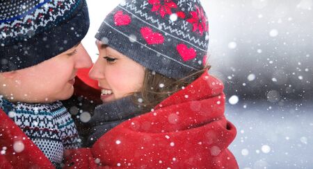 A loving couple walking in winter park.の写真素材