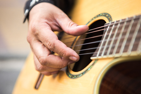 Guitarist plays the guitar. Close-up of handsの写真素材