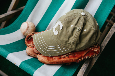 Baseball cap of captain, ball and leather catcher's gloveの写真素材