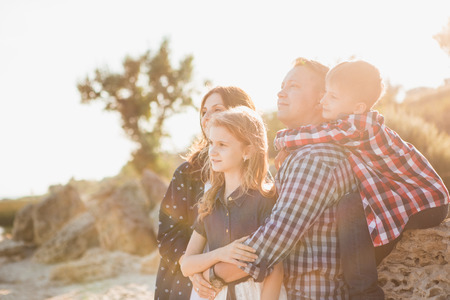 Father mother daughter and son. Family walking in national parkの写真素材