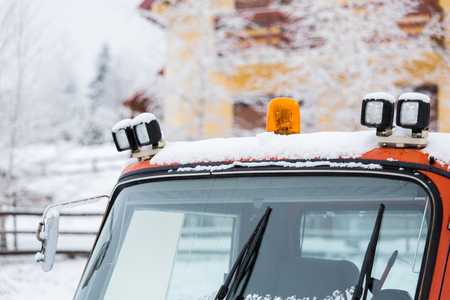 Red snowcat bulldozer on the mountains ski resortの写真素材