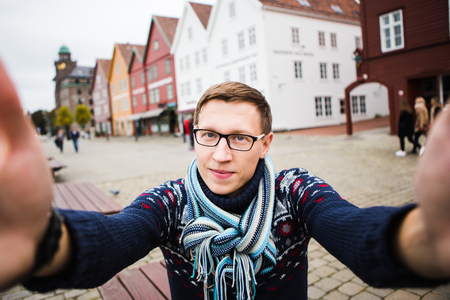 Traveler on a background of colorful houses in Europe.の写真素材