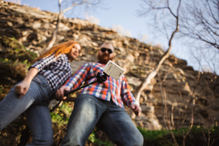 Man and woman make selfie at the top of the mountain.の写真素材