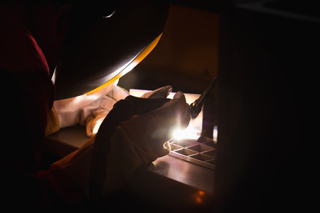 Welder at the modern factory at workの写真素材