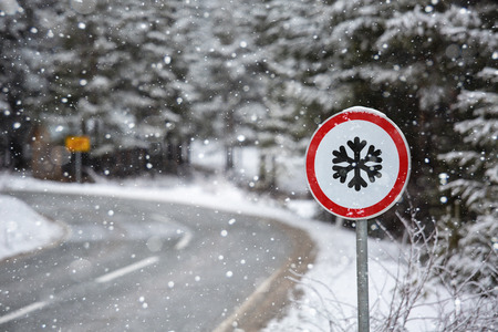 Winter mountains road with sign of snowの写真素材