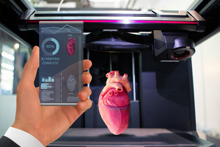 Hand with futuristic transparent smartphone. Application for printing human organs in a 3D printer.