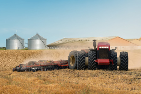 Autonomous tractor working on the field. Smart farmingの写真素材