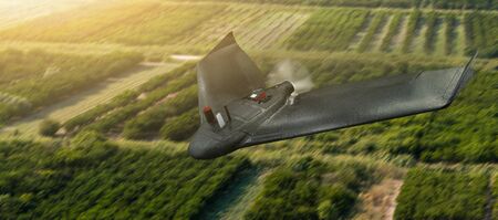 Drone flies over agricultural valley