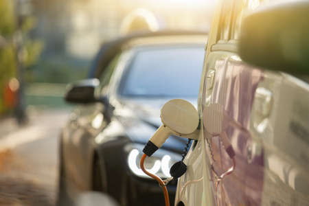 Carsharing electric car with charging stationの写真素材