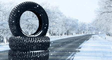 Winter tires on a snowy road. Seasonal tire change.の写真素材