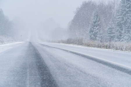 Winter road through the forestの写真素材
