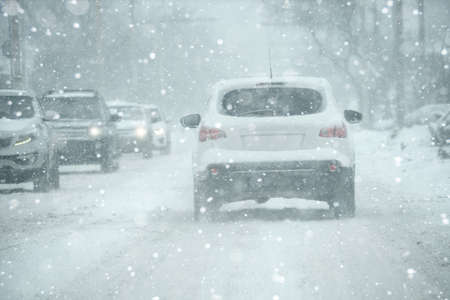 The car is driving on a winter cityの写真素材