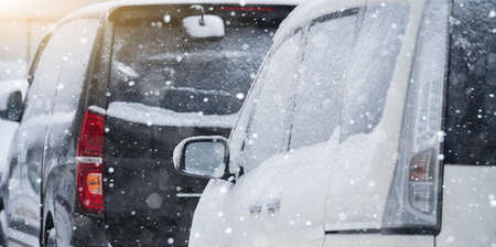 Parked cars covered with snow. Winter seasonの写真素材