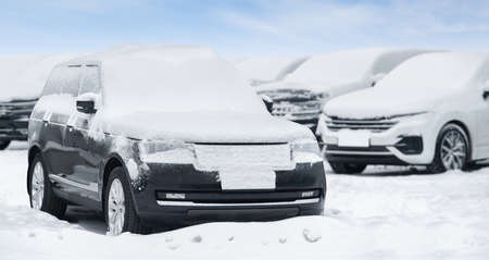 Parked cars covered with snow. Winter seasonの写真素材