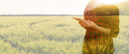 Woman farmer with tablet. Double exposure with wheat field. Smart farming and digital agriculture...