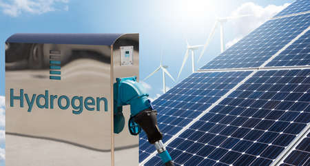 Hydrogen gas station with solar panels and wind turbines in the background. Getting green hydrogen from renewable energy sourcesの写真素材