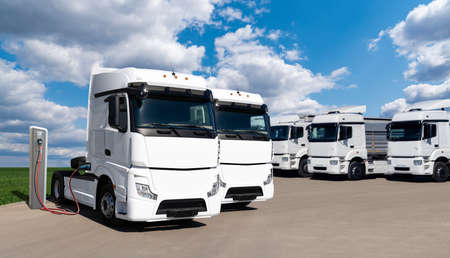 Electric trucks with charging stationの写真素材
