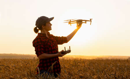 Woman farmer with drone