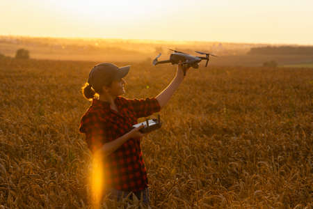 Woman farmer with drone